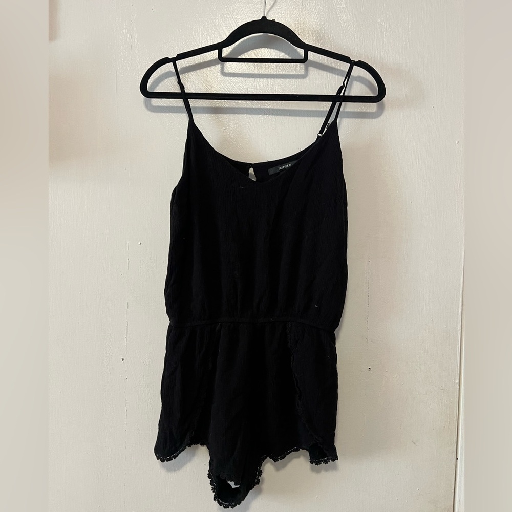 Black romper with crochet details